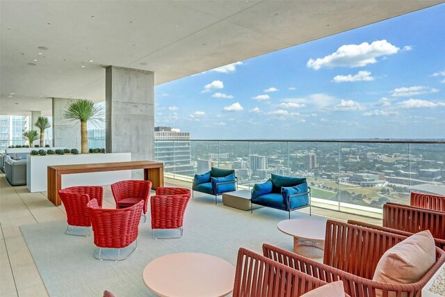 balcony with an outdoor hangout area and a view of city