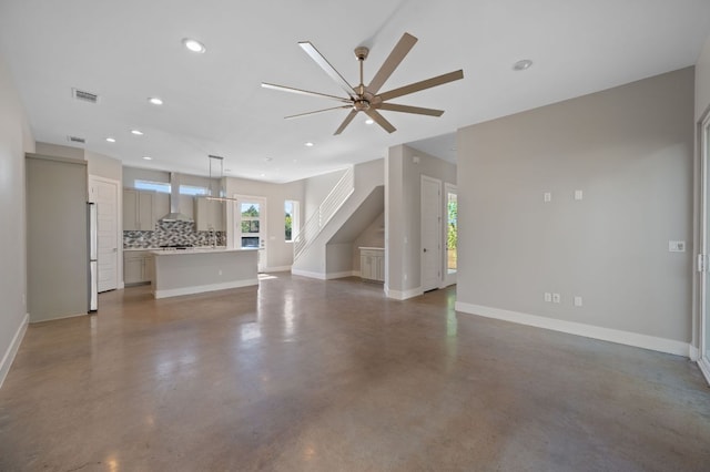 1210 Stobaugh St Unit B, Austin, TX 78757 - unfurnished living room with concrete floors, a ceiling fan, visible vents, baseboards, and recessed lighting