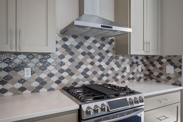 1210 Stobaugh St Unit B, Austin, TX 78757 - kitchen featuring wall chimney range hood, backsplash, gas range, and light countertops
