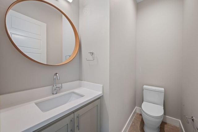 1210 Stobaugh St Unit B, Austin, TX 78757 - bathroom with vanity, toilet, and baseboards