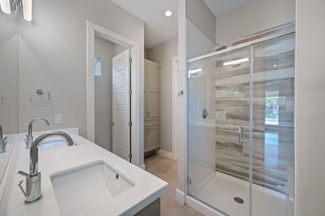 1210 Stobaugh St Unit B, Austin, TX 78757 - bathroom with a stall shower, recessed lighting, double vanity, and a sink