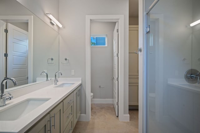 1210 Stobaugh St Unit B, Austin, TX 78757 - bathroom with a sink, double vanity, toilet, and walk in shower