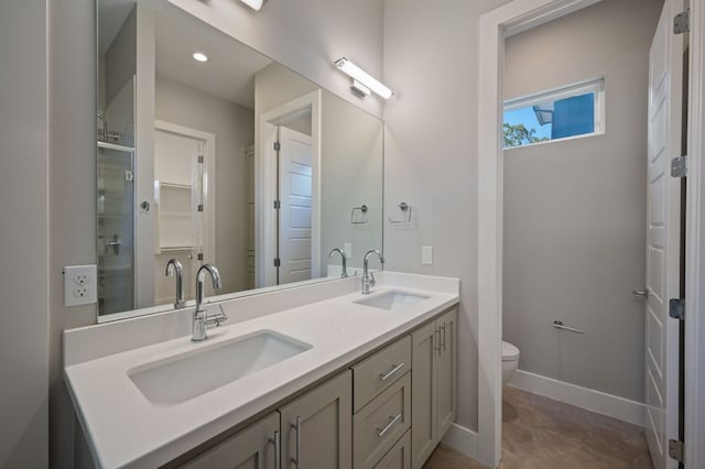 1210 Stobaugh St Unit B, Austin, TX 78757 - bathroom with double vanity, toilet, baseboards, and a sink