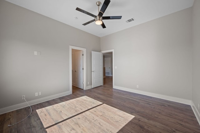 1210 Stobaugh St Unit B, Austin, TX 78757 - unfurnished bedroom featuring wood finished floors, visible vents, baseboards, and ceiling fan