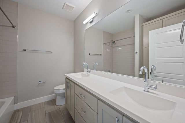 1210 Stobaugh St Unit B, Austin, TX 78757 - full bath featuring a sink, toilet, baseboards, and visible vents
