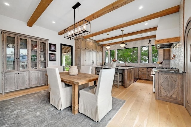 dining space with recessed lighting, light wood-style floors, and beam ceiling