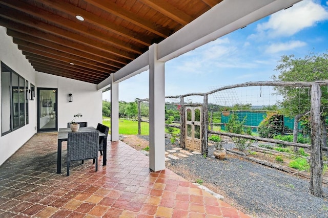 view of patio with fence and a gate