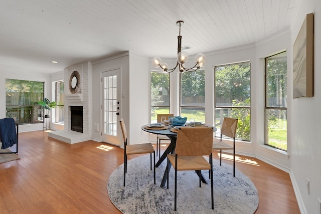 14400 Weldon Ln, Austin, TX 78728 - dining space with plenty of natural light, a chandelier, wood finished floors, baseboards, and crown molding