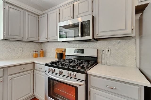 14400 Weldon Ln, Austin, TX 78728 - kitchen with appliances with stainless steel finishes and decorative backsplash