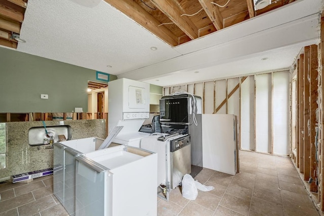 kitchen featuring light countertops, light tile patterned floors, and refrigerator