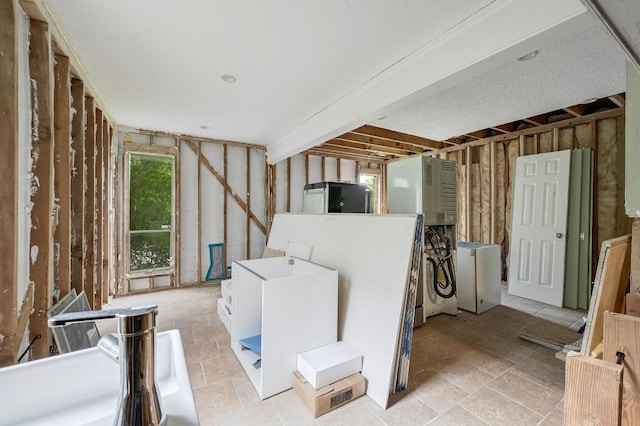 interior space featuring fridge and stone finish floor