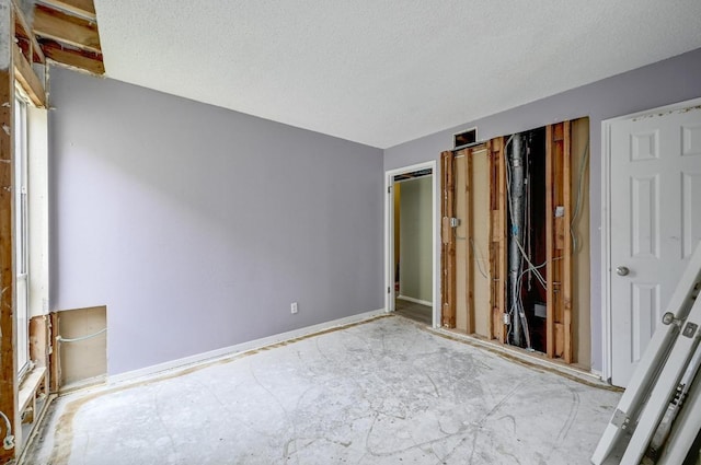 unfurnished bedroom featuring a textured ceiling