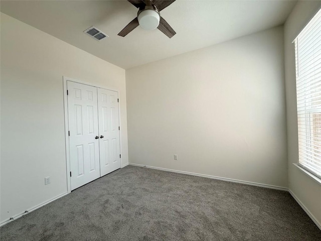 4482 Acerno St, Round Rock, TX 78665 - unfurnished bedroom with carpet floors, multiple windows, and a closet
