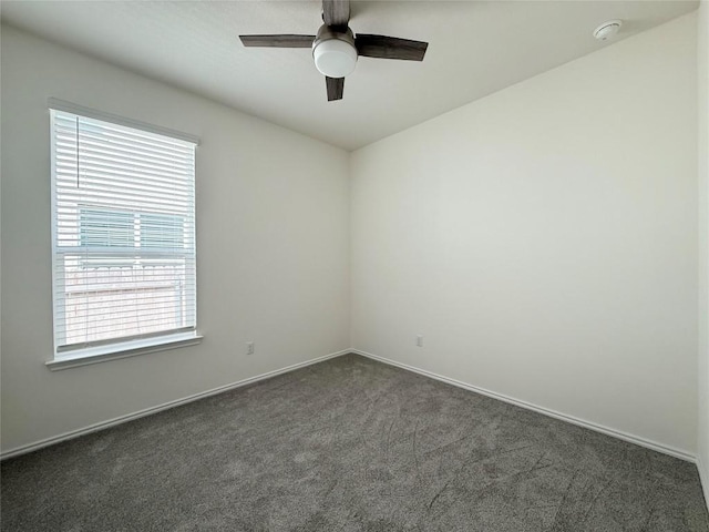 4482 Acerno St, Round Rock, TX 78665 - spare room featuring dark colored carpet, a smoke detector, and a ceiling fan