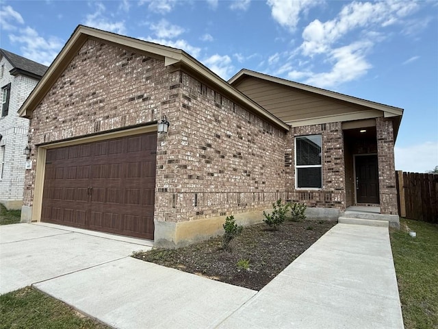 4482 Acerno St, Round Rock, TX 78665 - view of front of home with brick siding, a garage, and driveway