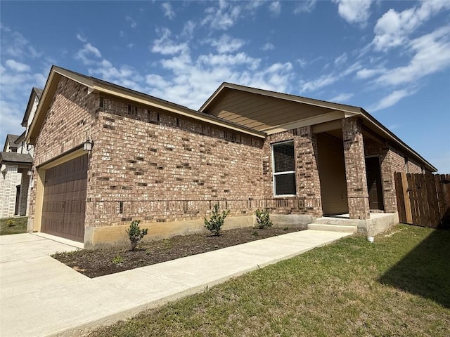 4482 Acerno St, Round Rock, TX 78665 - view of front facade featuring brick siding, a garage, and driveway