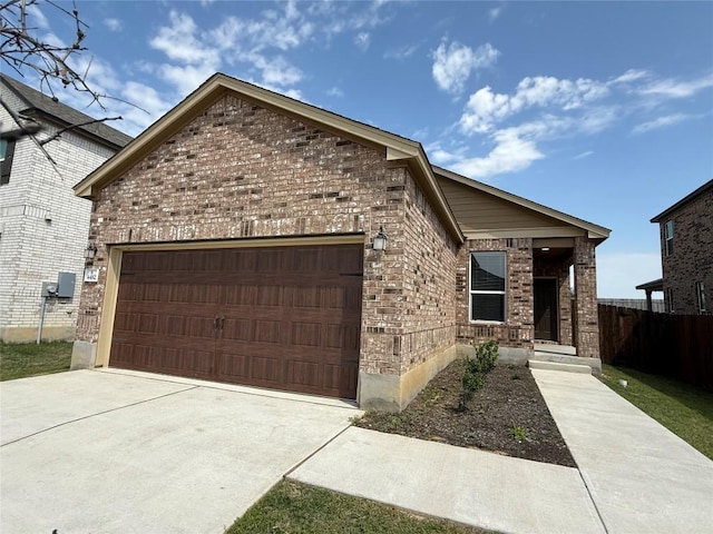 4482 Acerno St, Round Rock, TX 78665 - view of front facade featuring brick siding, driveway, and a garage