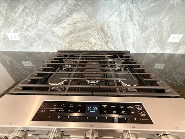 4482 Acerno St, Round Rock, TX 78665 - kitchen view of stainless steel range with gas cooktop and backsplash