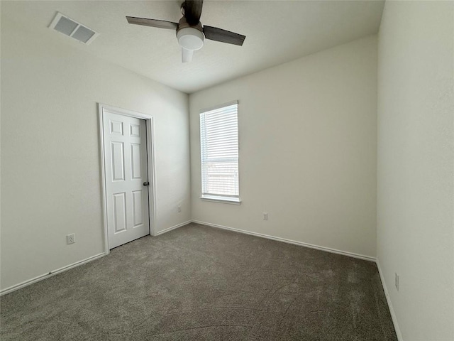 4482 Acerno St, Round Rock, TX 78665 - unfurnished bedroom featuring dark carpet and a ceiling fan