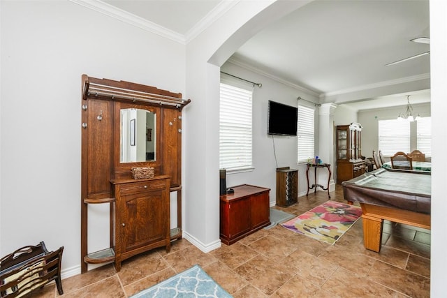 7241 Dunns Point Dr, Corpus Christi, TX 78414 - rec room with arched walkways, baseboards, a chandelier, and crown molding