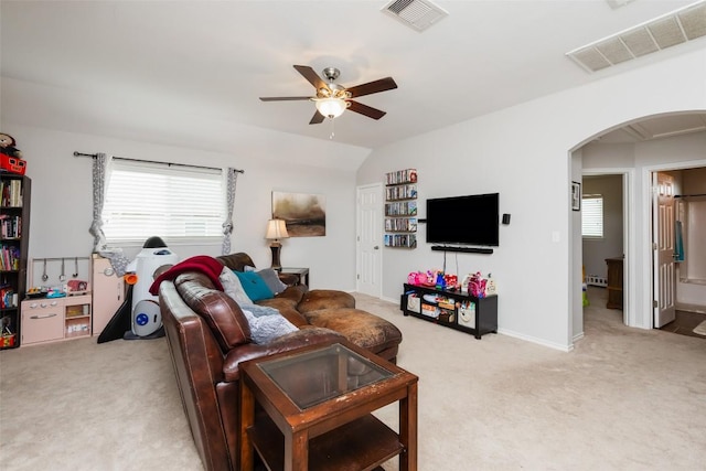 7241 Dunns Point Dr, Corpus Christi, TX 78414 - living room with arched walkways, light carpet, and visible vents
