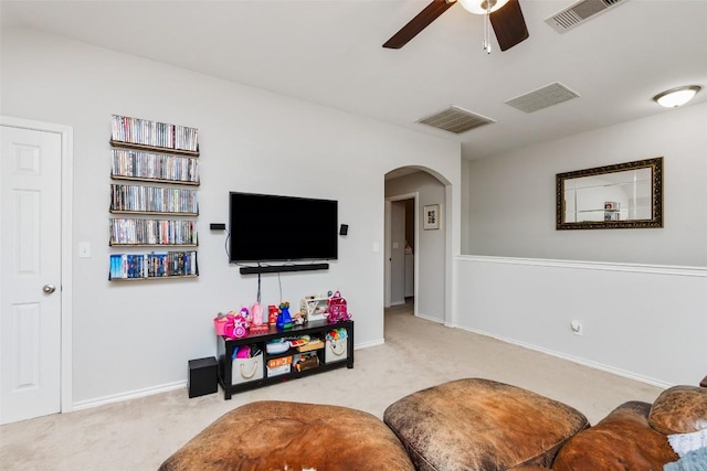 7241 Dunns Point Dr, Corpus Christi, TX 78414 - living area featuring carpet flooring, arched walkways, a ceiling fan, and visible vents