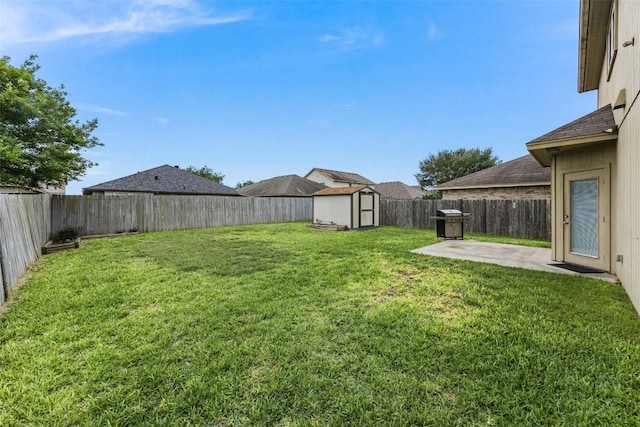 7241 Dunns Point Dr, Corpus Christi, TX 78414 - view of yard featuring a patio area, an outbuilding, a fenced backyard, and a storage unit