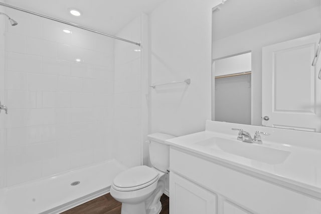 127 Safflower Dr, Uhland, TX 78640 - bathroom featuring a shower stall, vanity, toilet, and wood finished floors