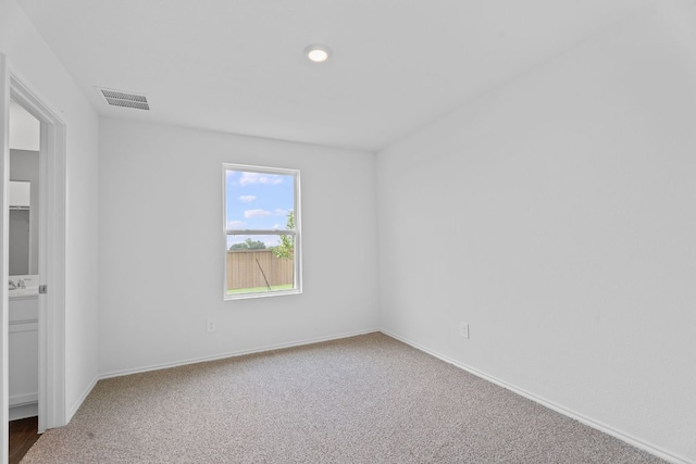 127 Safflower Dr, Uhland, TX 78640 - unfurnished bedroom featuring carpet, baseboards, and visible vents