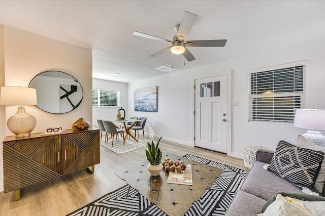 3703 Harmon Ave Unit 202, Austin, TX 78705 - living room featuring wood finished floors, a ceiling fan, and baseboards