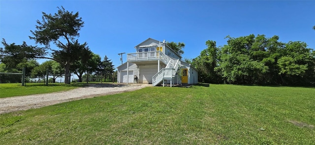 8660 Cedar Hill Rd, Brenham, TX 77833 - view of front facade with stairway, dirt driveway, a front lawn, and an attached garage