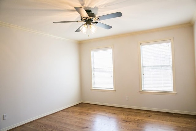 8660 Cedar Hill Rd, Brenham, TX 77833 - empty room with crown molding, plenty of natural light, wood finished floors, and ceiling fan