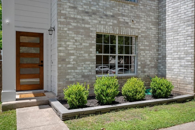 905 Whispering Hollow Dr, Kyle, TX 78640 - view of exterior entry with brick siding