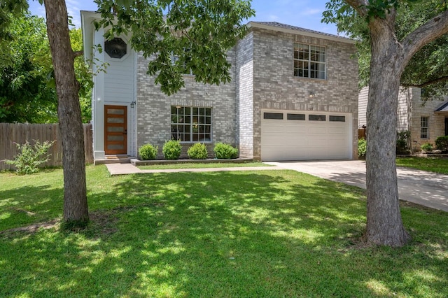 905 Whispering Hollow Dr, Kyle, TX 78640 - view of front of house featuring fence, brick siding, driveway, a garage, and a front yard