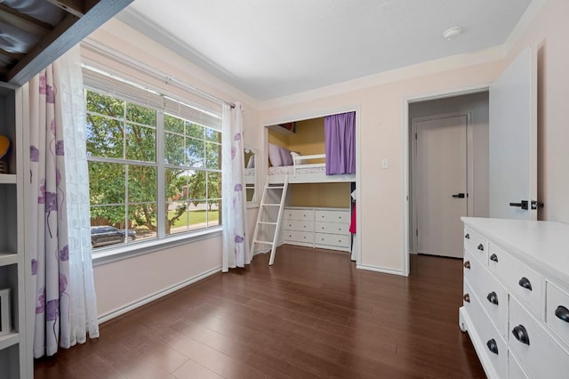 905 Whispering Hollow Dr, Kyle, TX 78640 - unfurnished bedroom featuring baseboards and dark wood-style floors