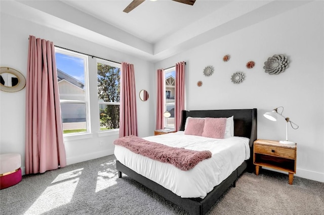 carpeted bedroom with baseboards and a ceiling fan