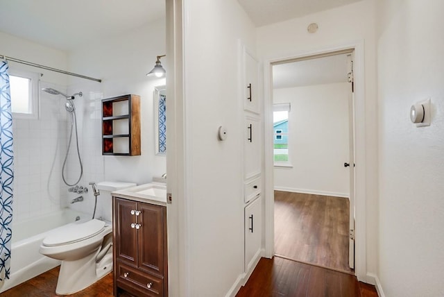 302 Garden Ct, Round Rock, TX 78664 - bathroom with vanity, shower / tub combo with curtain, toilet, and wood finished floors