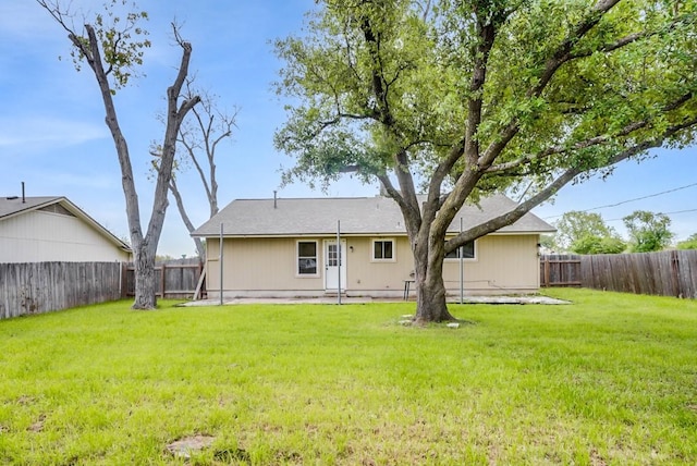 302 Garden Ct, Round Rock, TX 78664 - back of property featuring a yard and a fenced backyard