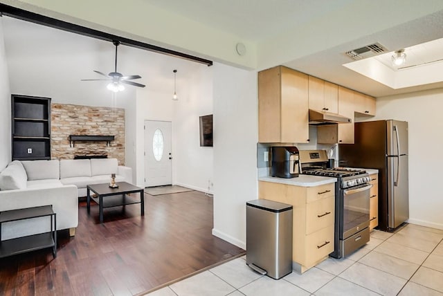 302 Garden Ct, Round Rock, TX 78664 - kitchen featuring a ceiling fan, light brown cabinetry, baseboards, visible vents, and appliances with stainless steel finishes
