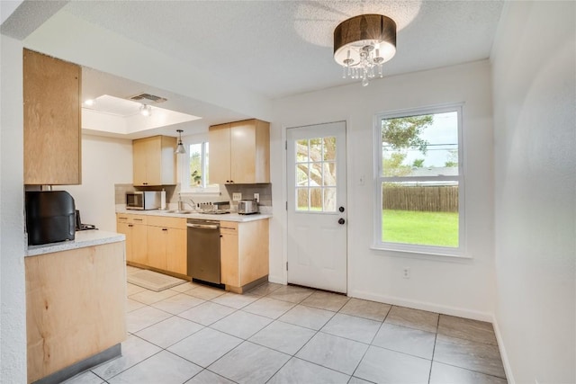 302 Garden Ct, Round Rock, TX 78664 - kitchen with a wealth of natural light, light countertops, visible vents, and appliances with stainless steel finishes