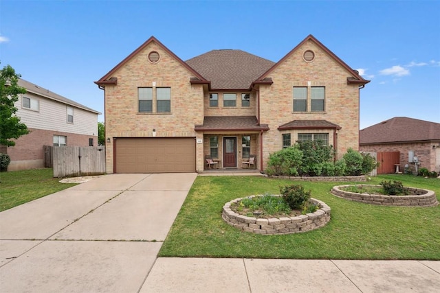 view of front of property featuring fence, a garage, a front lawn, and brick siding