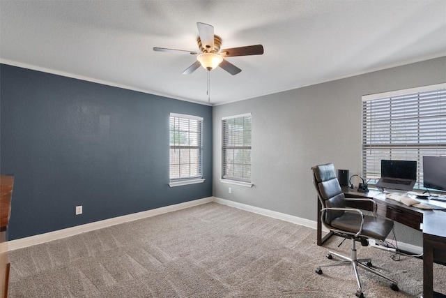 home office with baseboards, ornamental molding, ceiling fan, and carpet floors