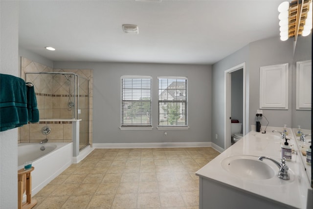 bathroom with a garden tub, baseboards, a shower stall, and a sink