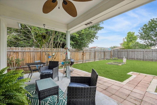 view of patio featuring a ceiling fan and a fenced backyard