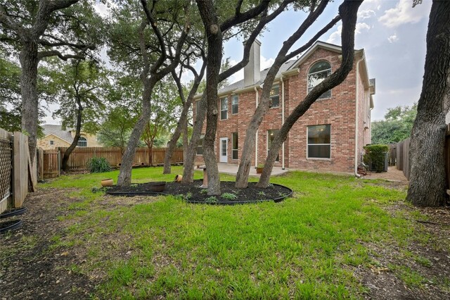 2509 Salorn Way, Round Rock, TX 78681 - fenced backyard featuring a patio
