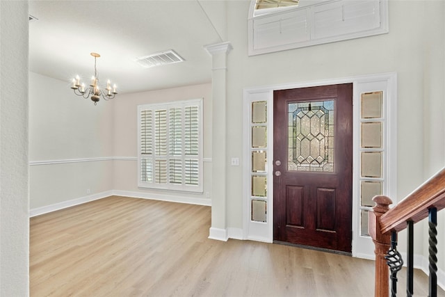 2509 Salorn Way, Round Rock, TX 78681 - foyer featuring an inviting chandelier, baseboards, visible vents, and wood finished floors