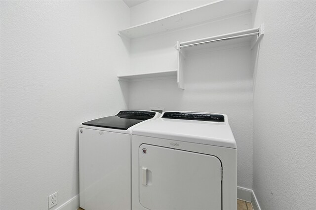 2509 Salorn Way, Round Rock, TX 78681 - laundry room with washing machine and clothes dryer and baseboards