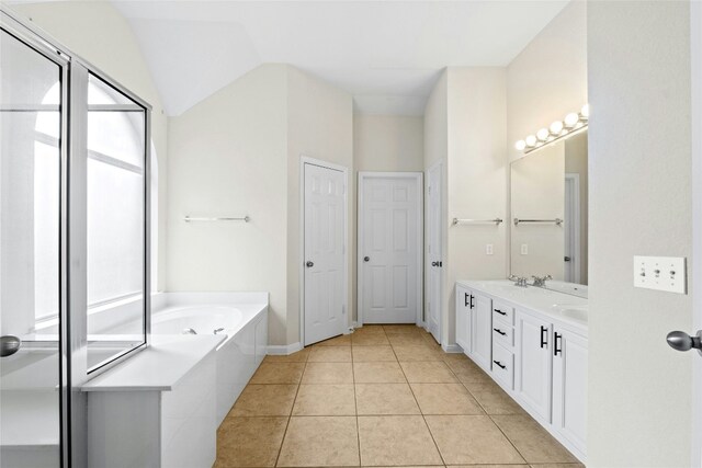 2509 Salorn Way, Round Rock, TX 78681 - bathroom with double vanity, a bath, and tile patterned floors