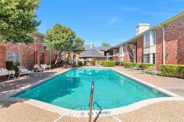 7920 Rockwood Ln Unit 115, Austin, TX 78757 - community pool featuring a gazebo and a patio area