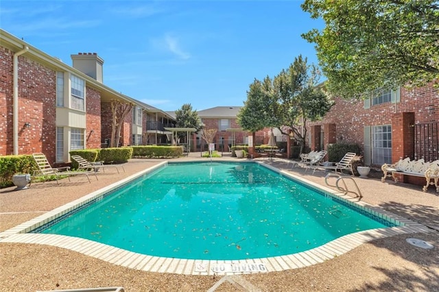 7920 Rockwood Ln Unit 115, Austin, TX 78757 - community pool with a patio area and a residential view